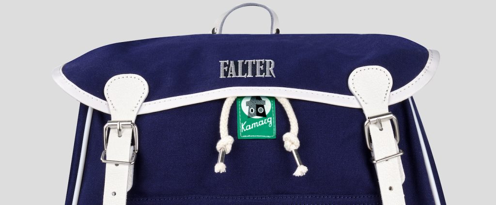 Kamarg mit Falter Logo.